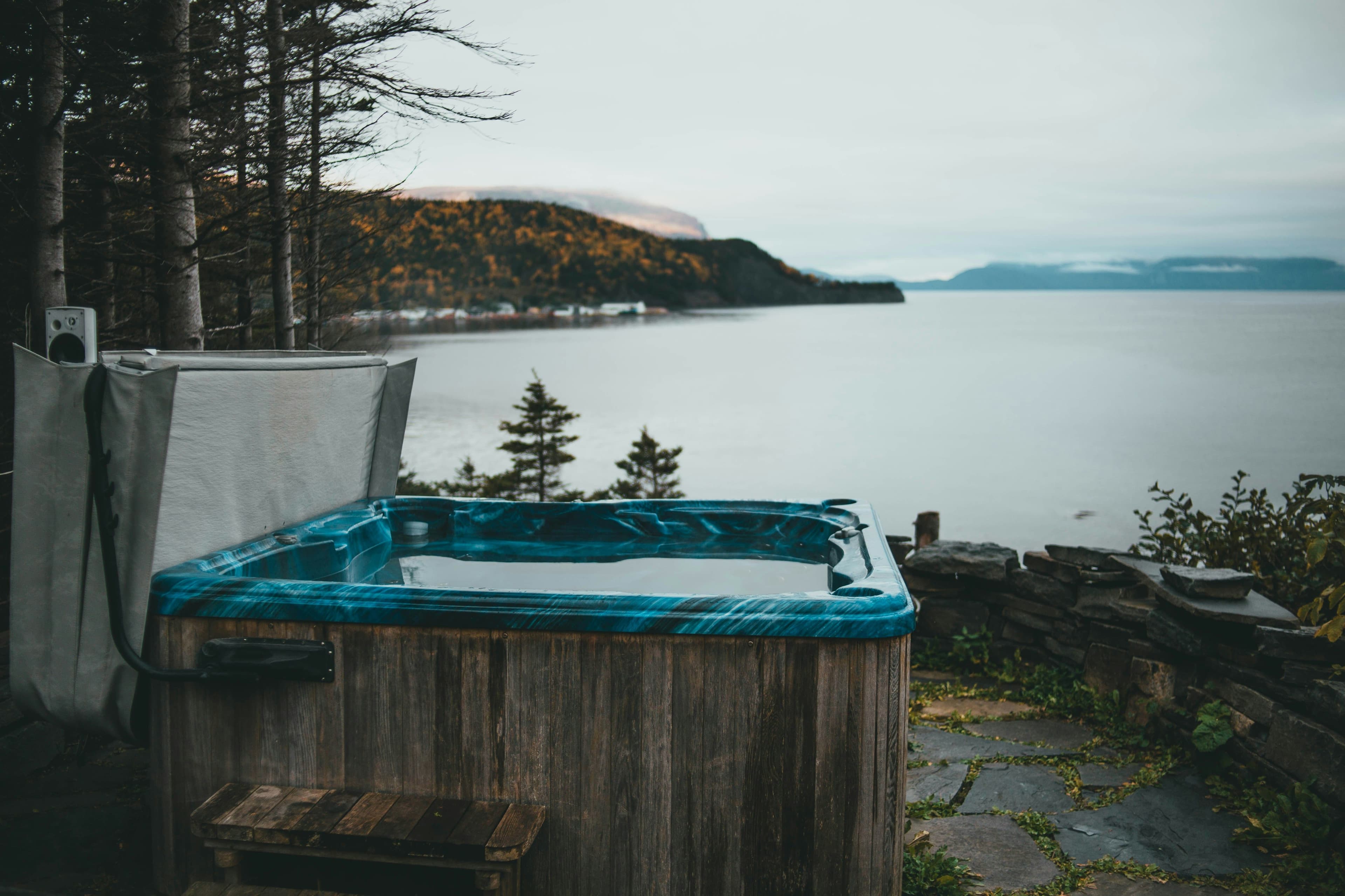 Crane lifting a hot tub for installation
